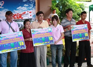Ministry of Transport officials present vouchers for prosthetic limbs to handicap victims of road accidents.
